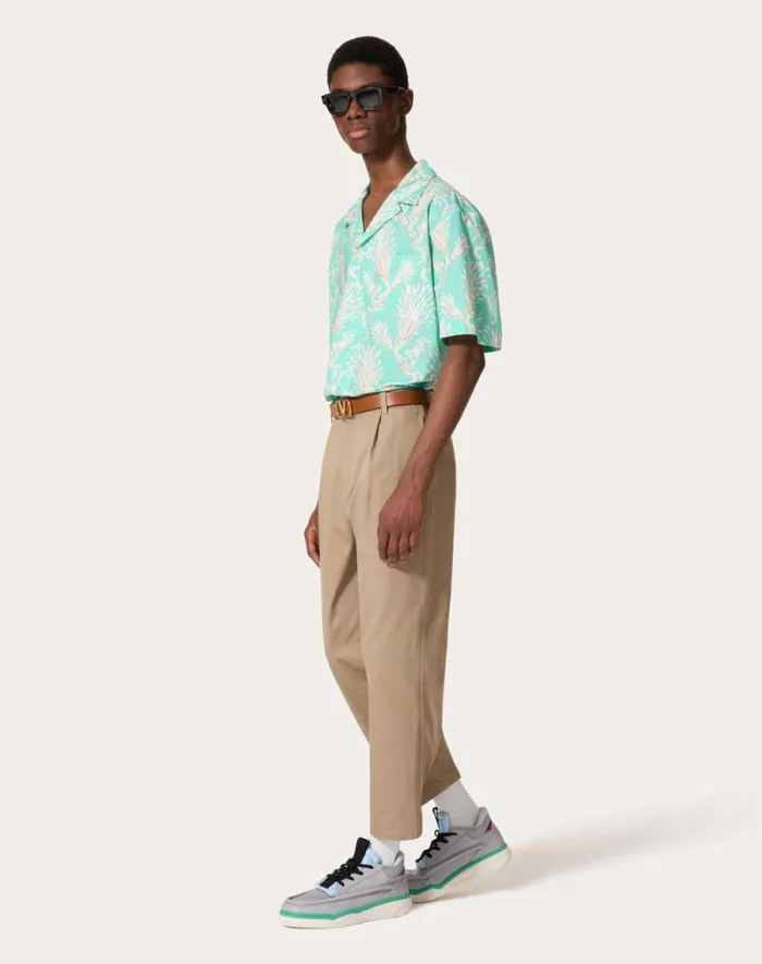 Valentino Shirts Man Cotton Poplin Bowling Shirt With Metamorphos Wheatsheaf Print For Man In Turquoisebeige Turquoisebeige Valentino Shirts Man Cotton Poplin Bowling Shirt With Metamorphos Wheatsheaf Print For Man In Turquoisebeige Turquoisebeige