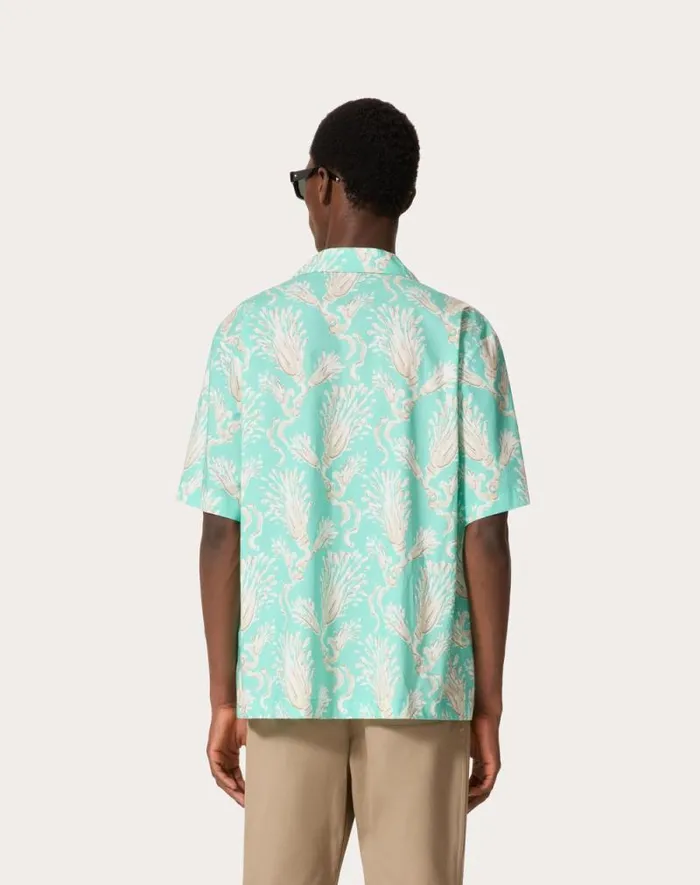 Valentino Shirts Man Cotton Poplin Bowling Shirt With Metamorphos Wheatsheaf Print For Man In Turquoisebeige Turquoisebeige Valentino Shirts Man Cotton Poplin Bowling Shirt With Metamorphos Wheatsheaf Print For Man In Turquoisebeige Turquoisebeige