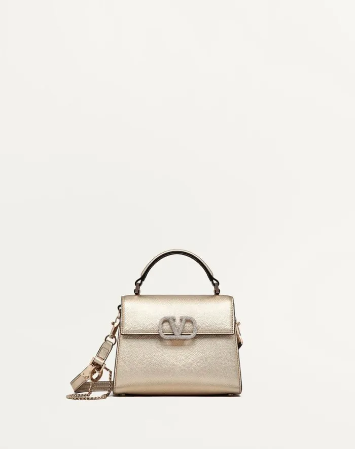 Valentino Top Handle Bags Woman Mini Vsling Handbag In Metallic Grainy Calfskin For Woman In Platinumcrystal Platinumcrystal Valentino Top Handle Bags Woman Mini Vsling Handbag In Metallic Grainy Calfskin For Woman In Platinumcrystal Platinumcrystal